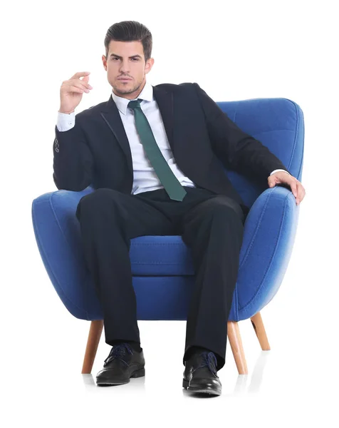 Человек, сидящий в кресле — стоковое фото