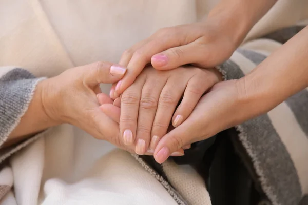 Senior woman and young caregiver — Stock Photo, Image