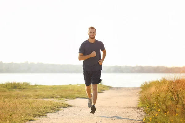 Sporty young man running — Stock Photo, Image