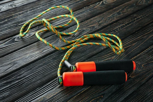 Jumping rope on wooden background — Stock Photo, Image