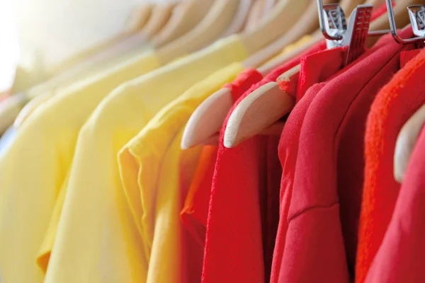 Hangers with color clothes — Stock Photo, Image