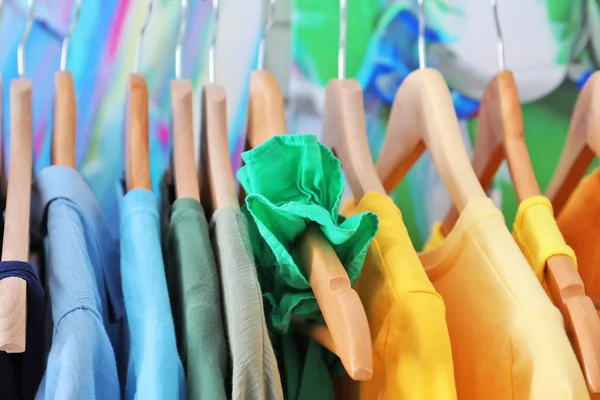 Hangers with color clothes — Stock Photo, Image