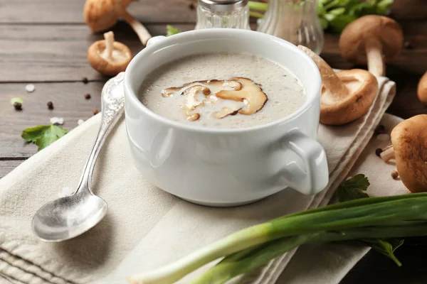 Bowl of creamy shiitake mushroom soup on table — Stock Photo, Image