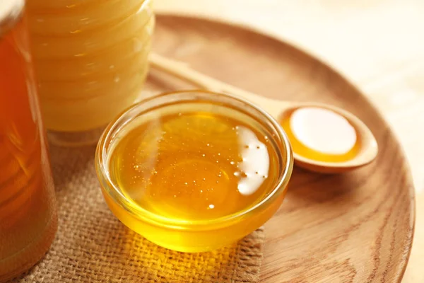 Glass bowl with honey — Stock Photo, Image