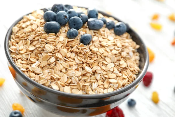 Bowl with oatmeal flakes — Stock Photo, Image