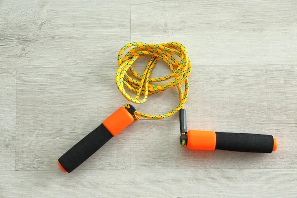 Jumping rope on wooden background — Stock Photo, Image