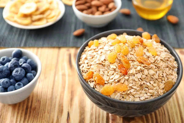 Bowl with oatmeal flakes — Stock Photo, Image