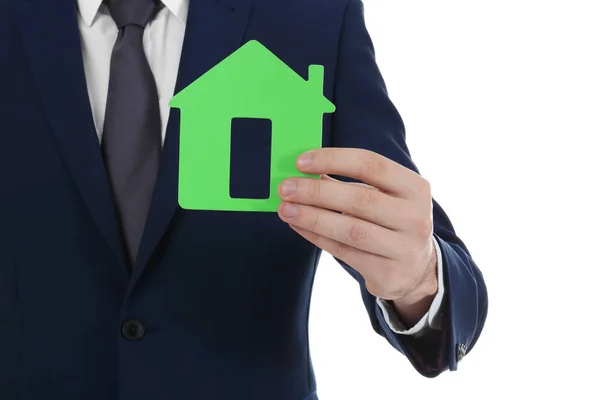 Real estate agent holding house model — Stock Photo, Image