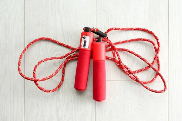 Jumping rope on wooden background — Stock Photo, Image