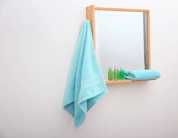 Clean towel hanging on mirror