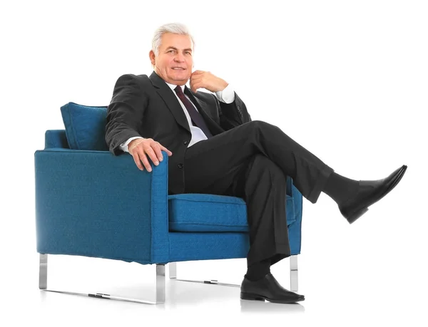 Hombre maduro sentado en sillón —  Fotos de Stock