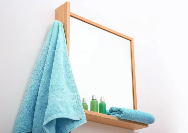 Clean towel hanging on mirror — Stock Photo, Image