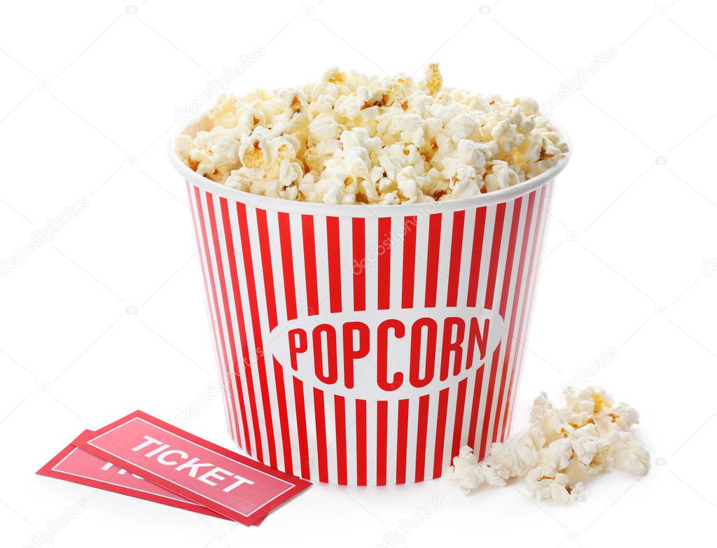 Cup with popcorn and cinema tickets