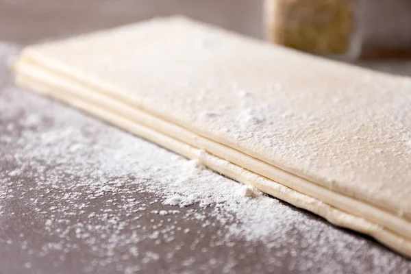 Flaky dough sheets on table, closeup — Stock Photo, Image