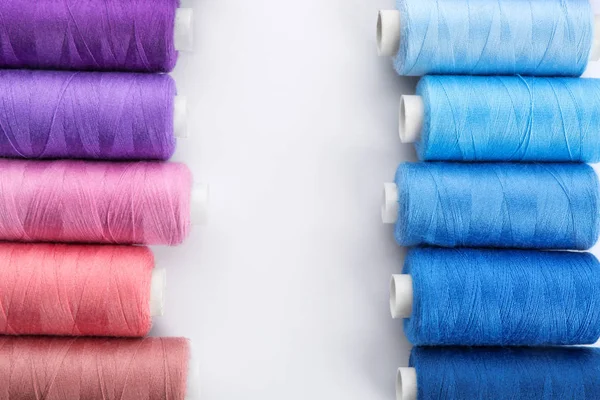 Colorful sewing threads on white background — Stock Photo, Image