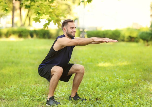 Sporty young man training outdoors