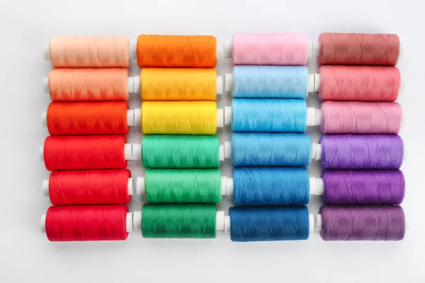 Colorful sewing threads on white background — Stock Photo, Image