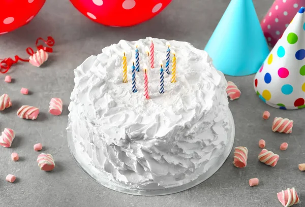 Delicious birthday cake with candles on table — Stock Photo, Image