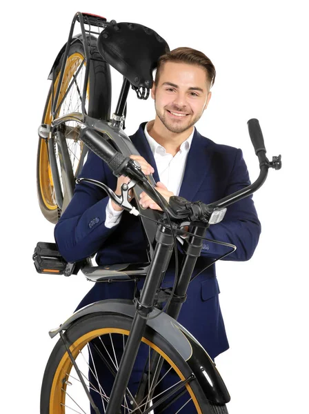 Młody przystojny biznesmen gospodarstwa roweru na białym tle — Zdjęcie stockowe