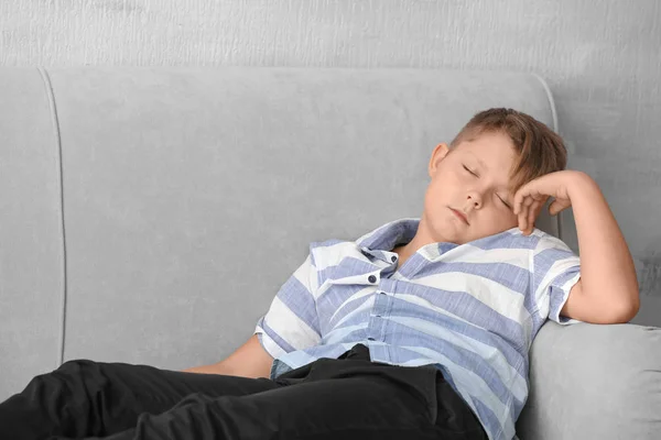 Overweight boy sleeping on sofa at home — Stock Photo, Image