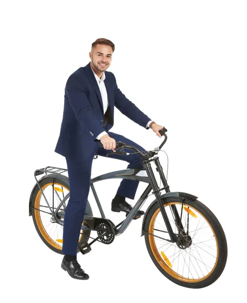 Ung snygg affärsman med cykel på vit bakgrund — Stockfoto