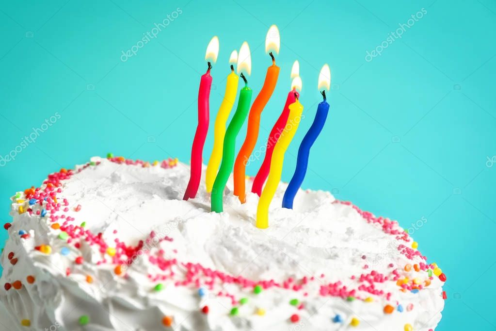 Birthday cake with candles against color background, closeup