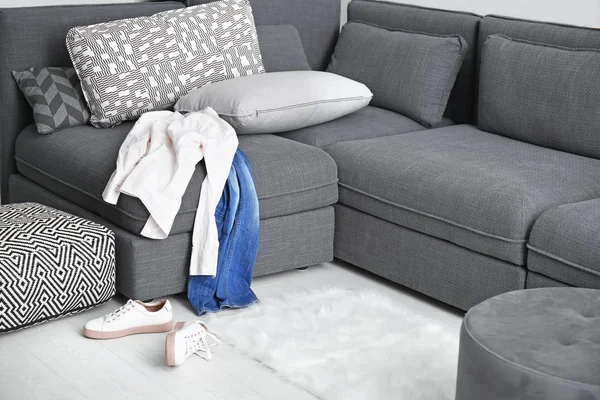 Dirty laundry scattered in living room