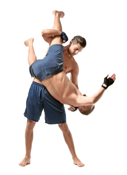 Attractive young men wrestling — Stock Photo, Image