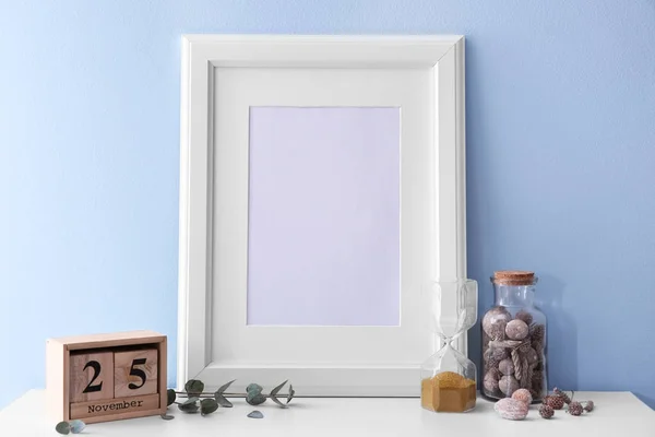 Mockup of blank frame with decor on color background — Stock Photo, Image