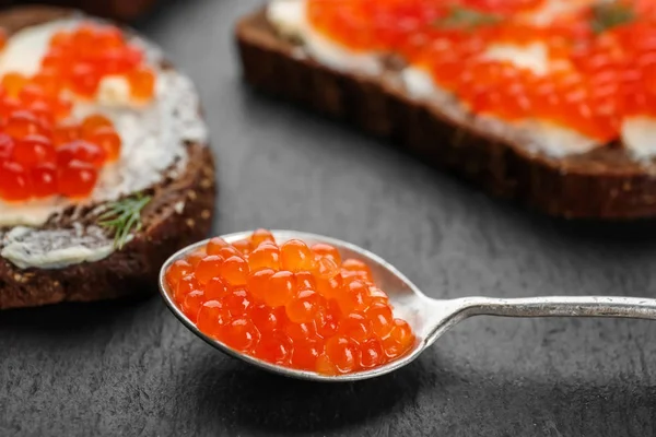 Spoon with delicious red caviar — Stock Photo, Image