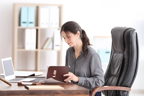 Young female notary working in office — Stock Photo, Image