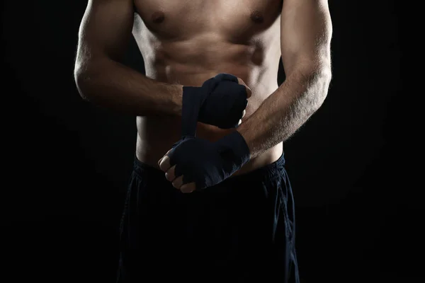 Male boxer applying wrist wraps — Stock Photo, Image