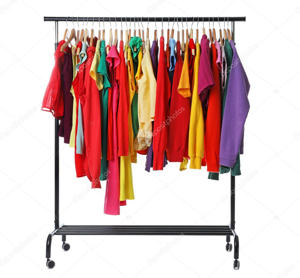 Rainbow clothes on rack, isolated on white