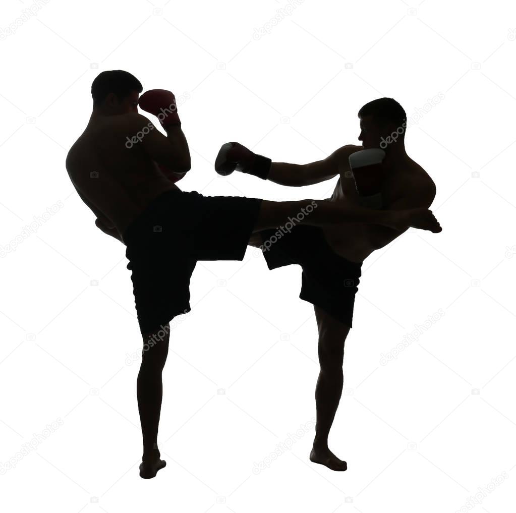 Silhouette of male boxers fighting