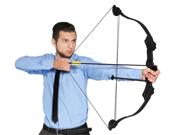 Young businessman practicing archery on white background — Stock Photo, Image