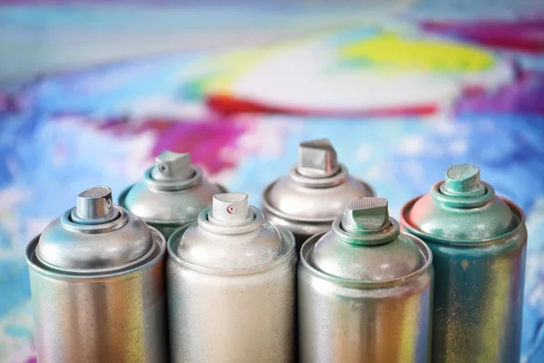 Aluminum aerosol cans with paints, closeup — Stock Photo, Image