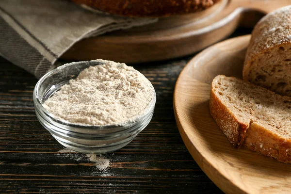 Glass bowl with buckwheat flour on table — Stock Photo, Image
