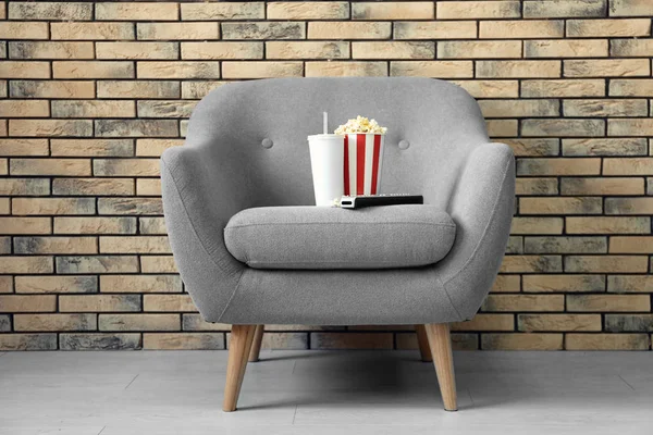 Comfortable armchair in home cinema. Watching movie