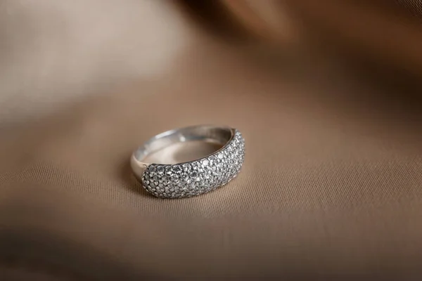 Beautiful engagement ring on fabric — Stock Photo, Image