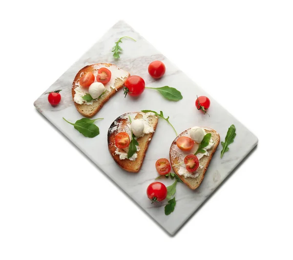 Board with delicious tomato and mozzarella sandwiches on white background — Stock Photo, Image