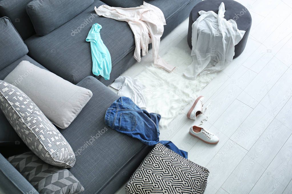 Dirty laundry scattered in living room