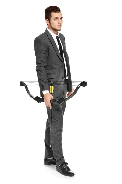 Young businessman with bow and arrow on white background — Stock Photo, Image