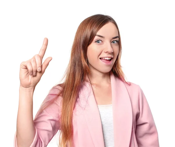 Ung attraktiv kvinde holder fingeren op på hvid baggrund - Stock-foto