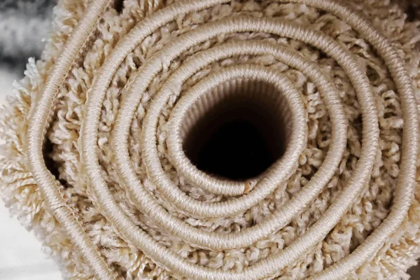 Rolled carpet, closeup. Room decoration