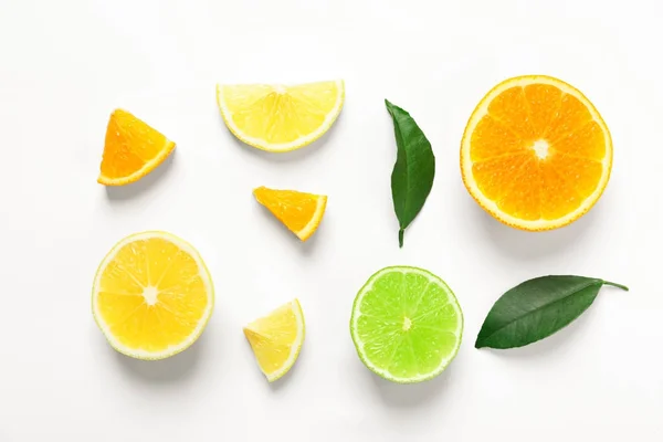 Composition with ripe lemon, orange and lime on white background — Stock Photo, Image