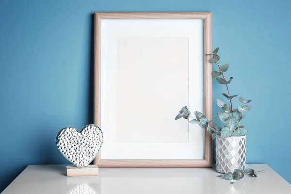 Empty Wooden Frame Decorative Heart Statuette Eucalyptus Table Color Wall — Stock Photo, Image