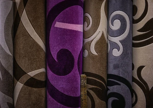 Assortment of different carpets in store — Stock Photo, Image