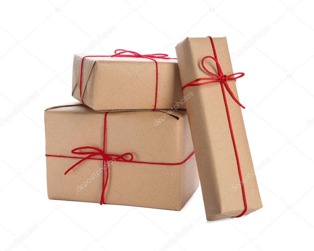 Parcel gift boxes with red bows on white background