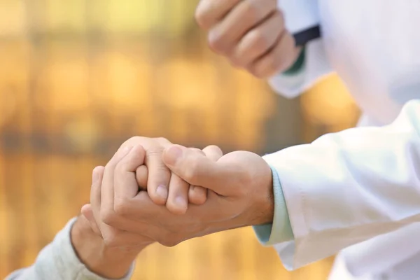 Young Caregiver Holding Hands Senior Man Closeup — Stock Photo, Image