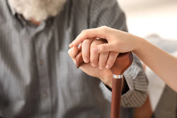 Senior Man Young Caregiver Holding Hands Walking Stick Closeup — Stock Photo, Image